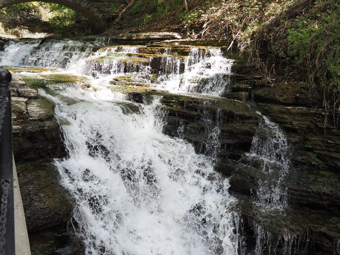 A waterfall cascades over rocks in Ithaca.